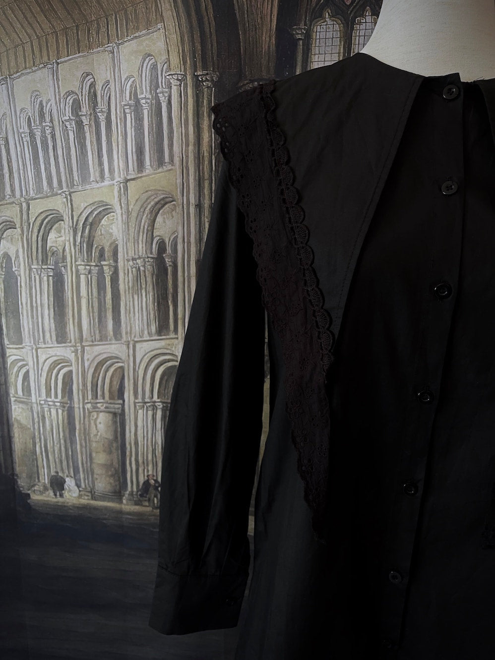 A Historically Inspired Medieval and Victorian Gothic Dagger Collar Tunic Blouse in Black with Lace Trim and Long Sleeves.