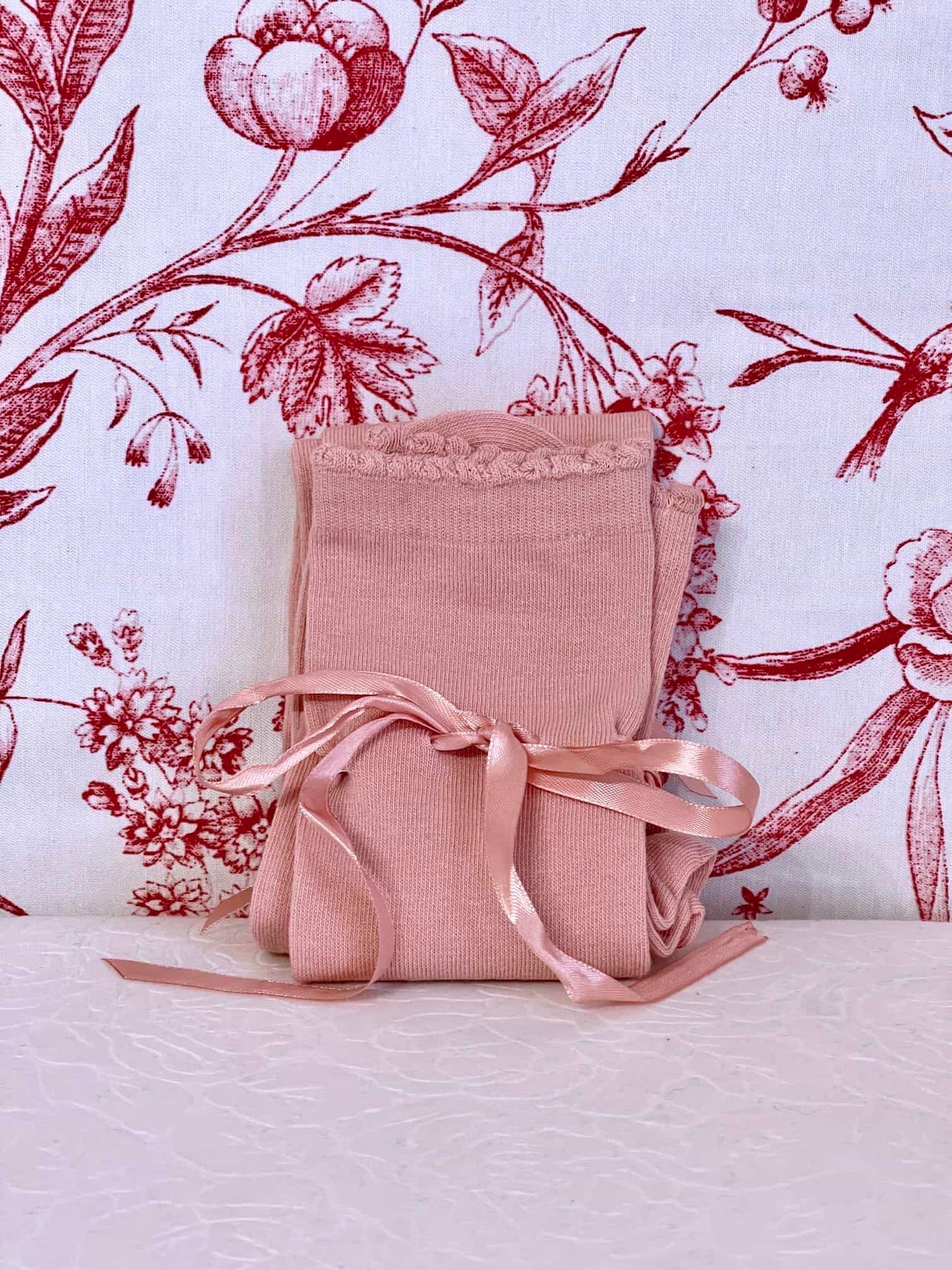 A pair of historically inspired knee high stocking socks in ballerina pink, for edwardian, victorian, regency, rococo, baroque, renaissance, and medieval era fashion.
