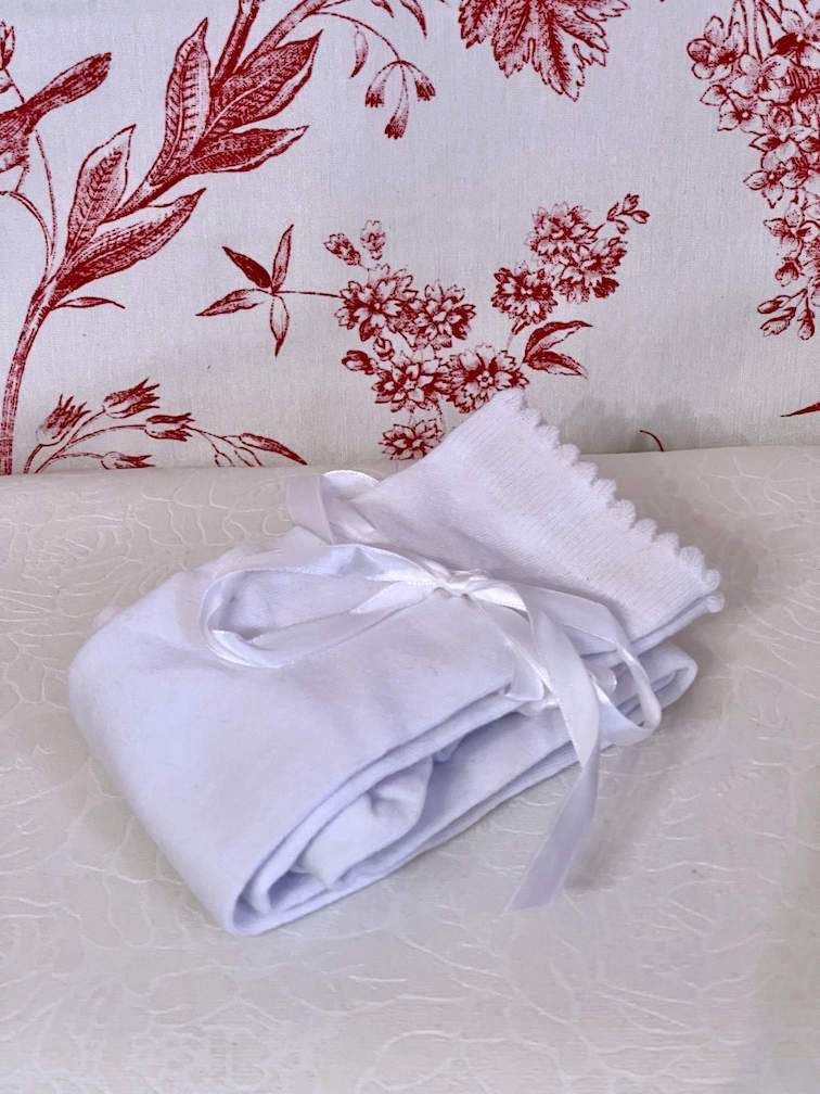 A pair of Historically Inspired Cotton Knee-High Socks with Ribbon Lacing in White, for Medieval, Renaissance, Baroque, Rococo, Regency, Victorian, or Edwardian fashion.