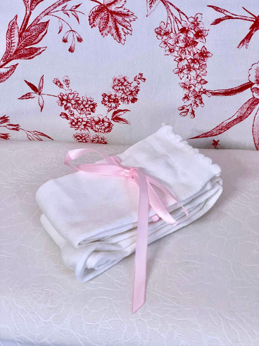 A pair of Historically Inspired Cotton Knee-High Socks with Ribbon Lacing in White and Pink, for Medieval, Renaissance, Baroque, Rococo, Regency, Victorian, or Edwardian fashion.