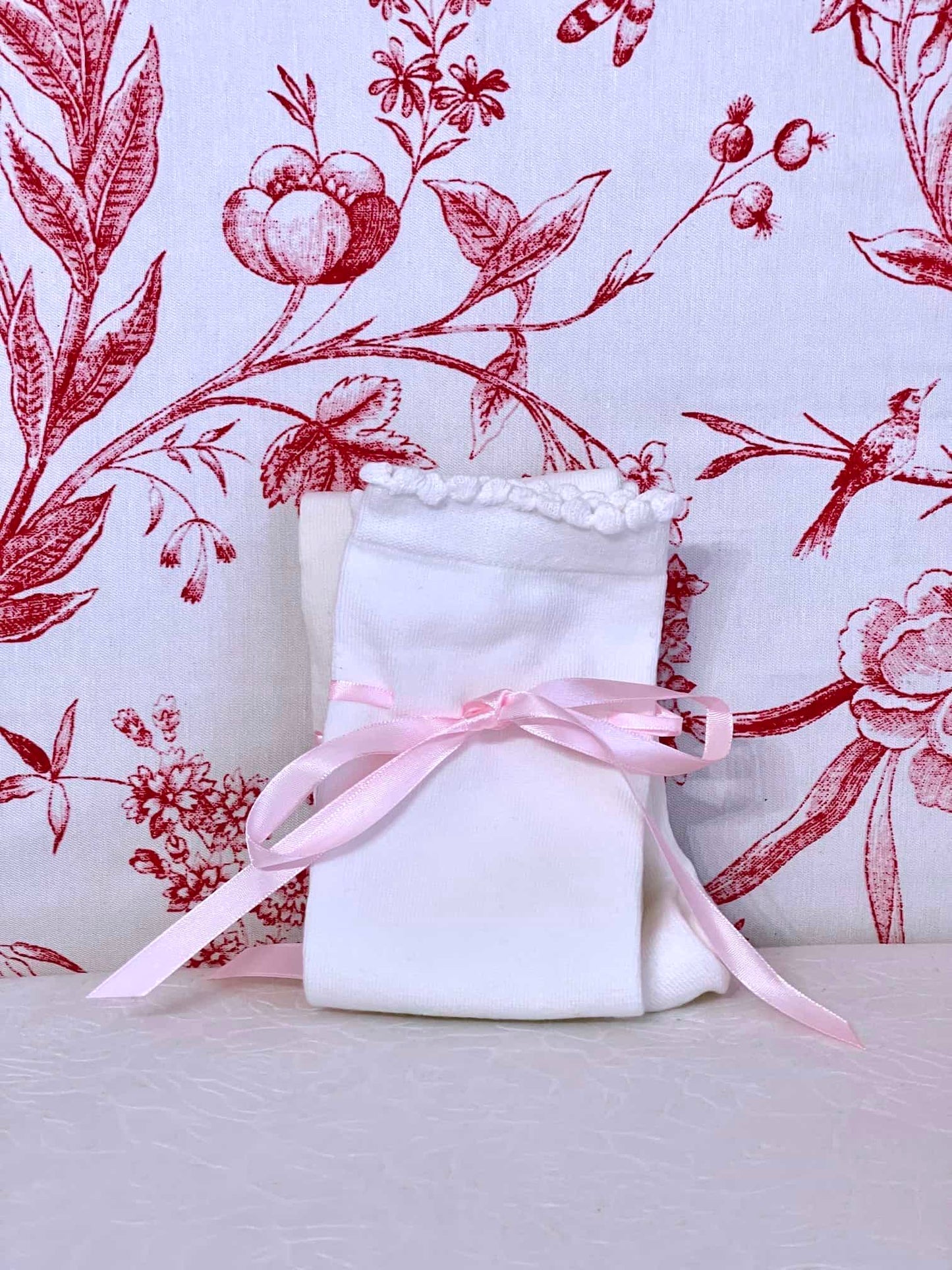 A pair of Historically Inspired Cotton Knee-High Socks with Ribbon Lacing in White and Pink, for Medieval, Renaissance, Baroque, Rococo, Regency, Victorian, or Edwardian fashion.