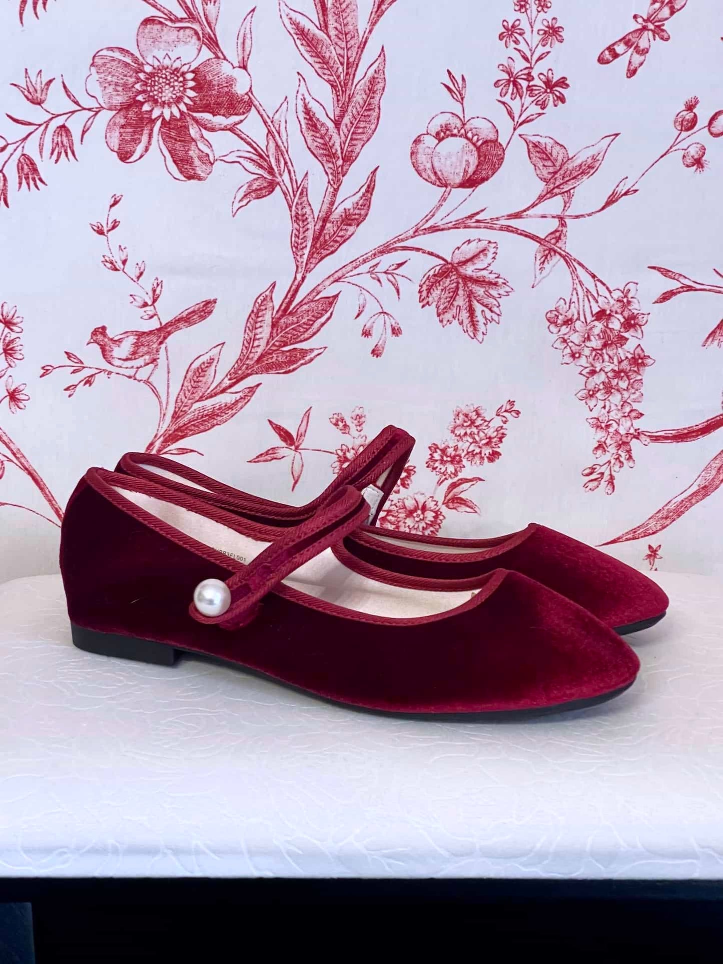 A pair of Historically Inspired Renaissance, Tudor, Baroque era Velvet Slipper Flats in Burgundy with pearl decorative button.