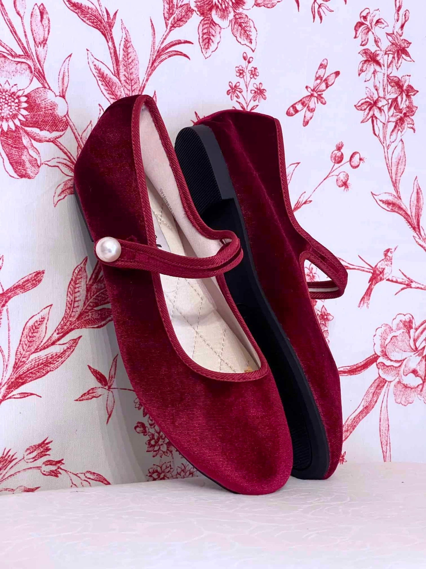 A pair of Historically Inspired Renaissance, Tudor, Baroque era Velvet Slipper Flats in Burgundy with pearl decorative button.