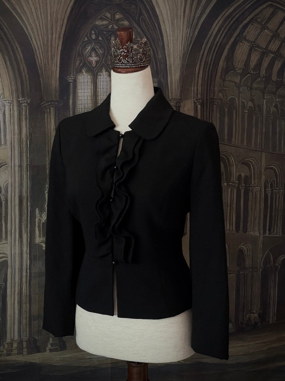 Historically inspired Victorian-inspired tailored ruffle jabot jacket coat with button front.
