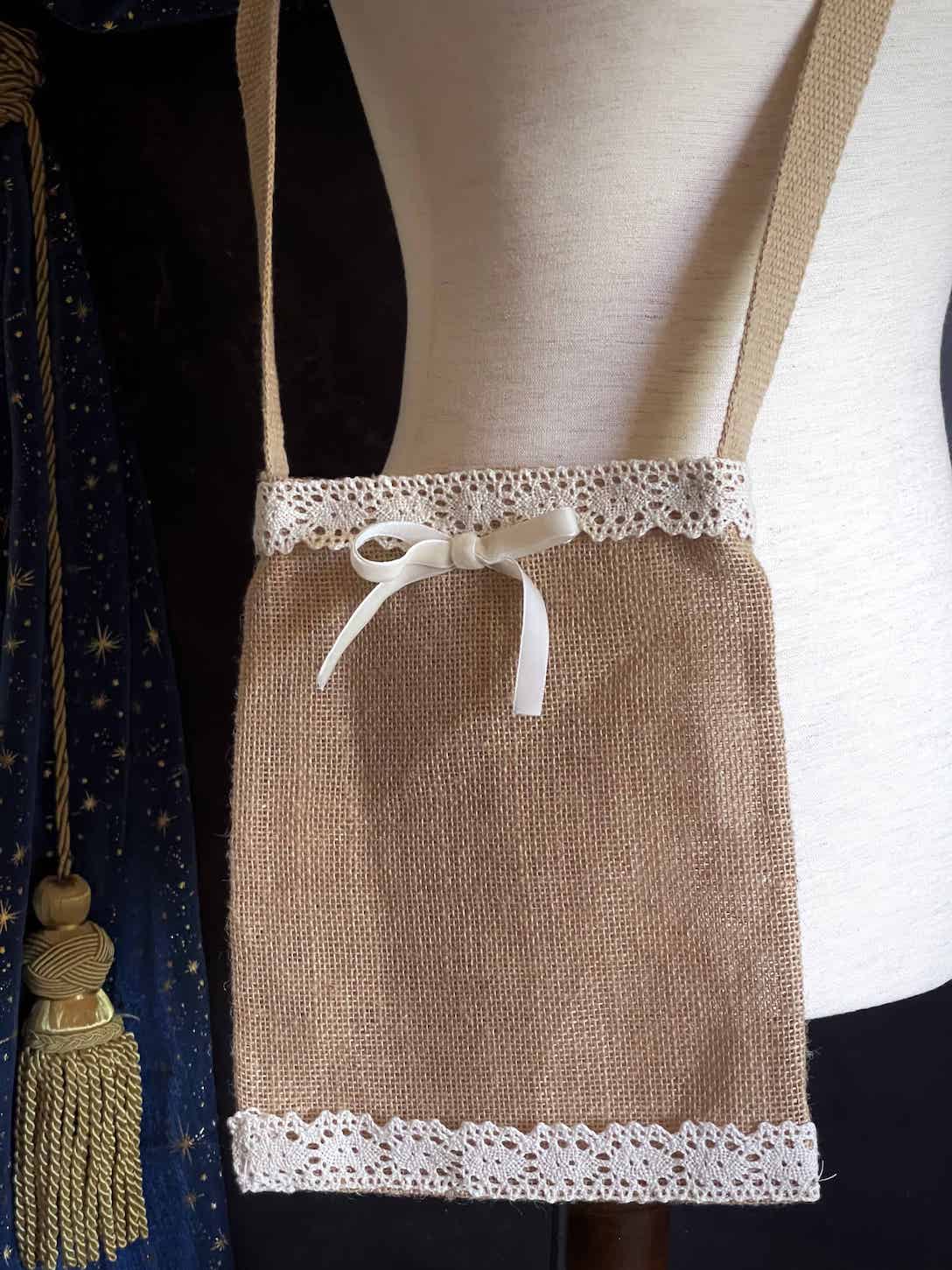 A cottagecore folk print historically inspired vintage style Handmade Lace-Trimmed Burlap Crossbody Bag in Lilac x Ivory