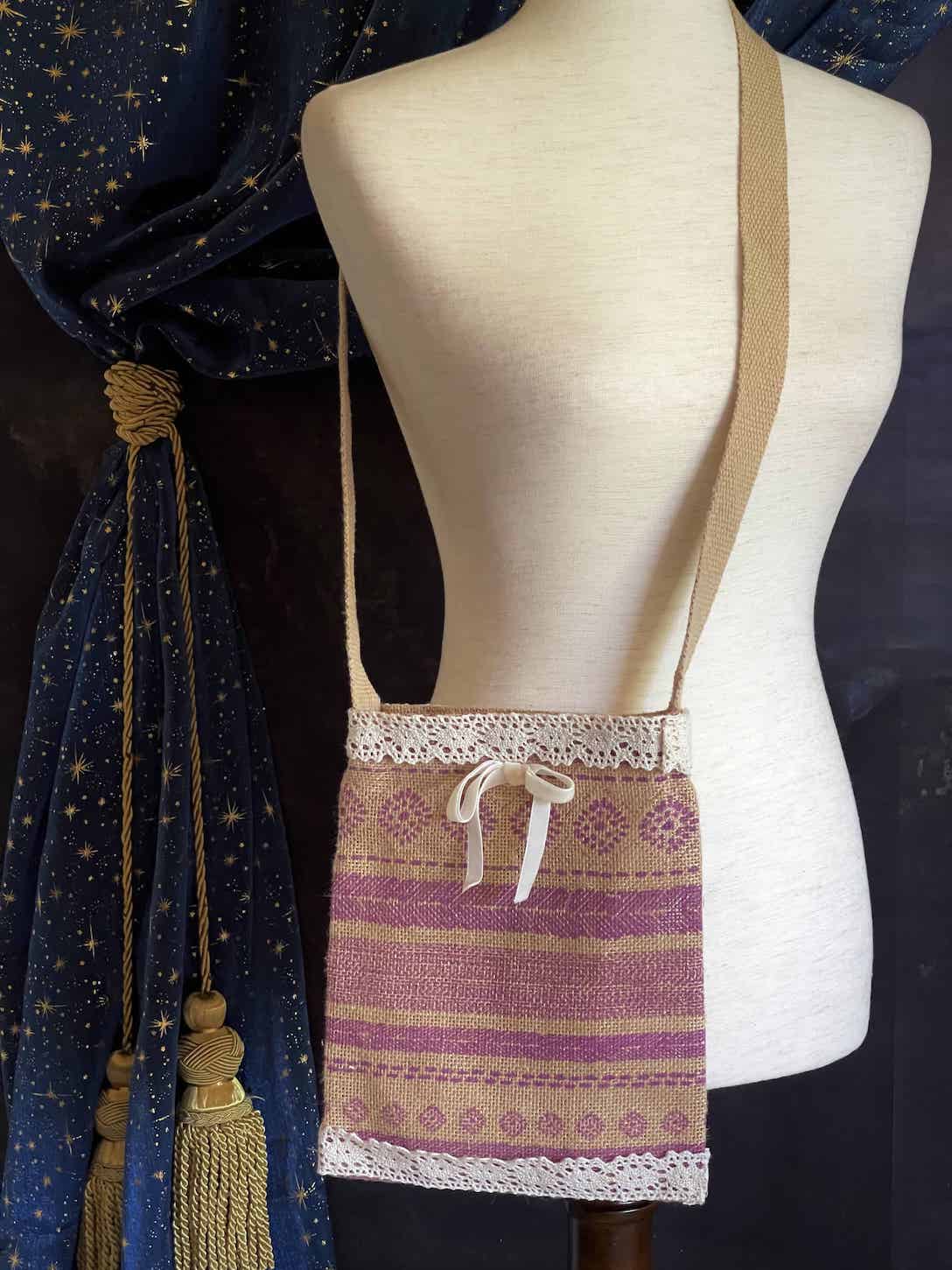A cottagecore folk print historically inspired vintage style Handmade Lace-Trimmed Burlap Crossbody Bag in Lilac x Ivory