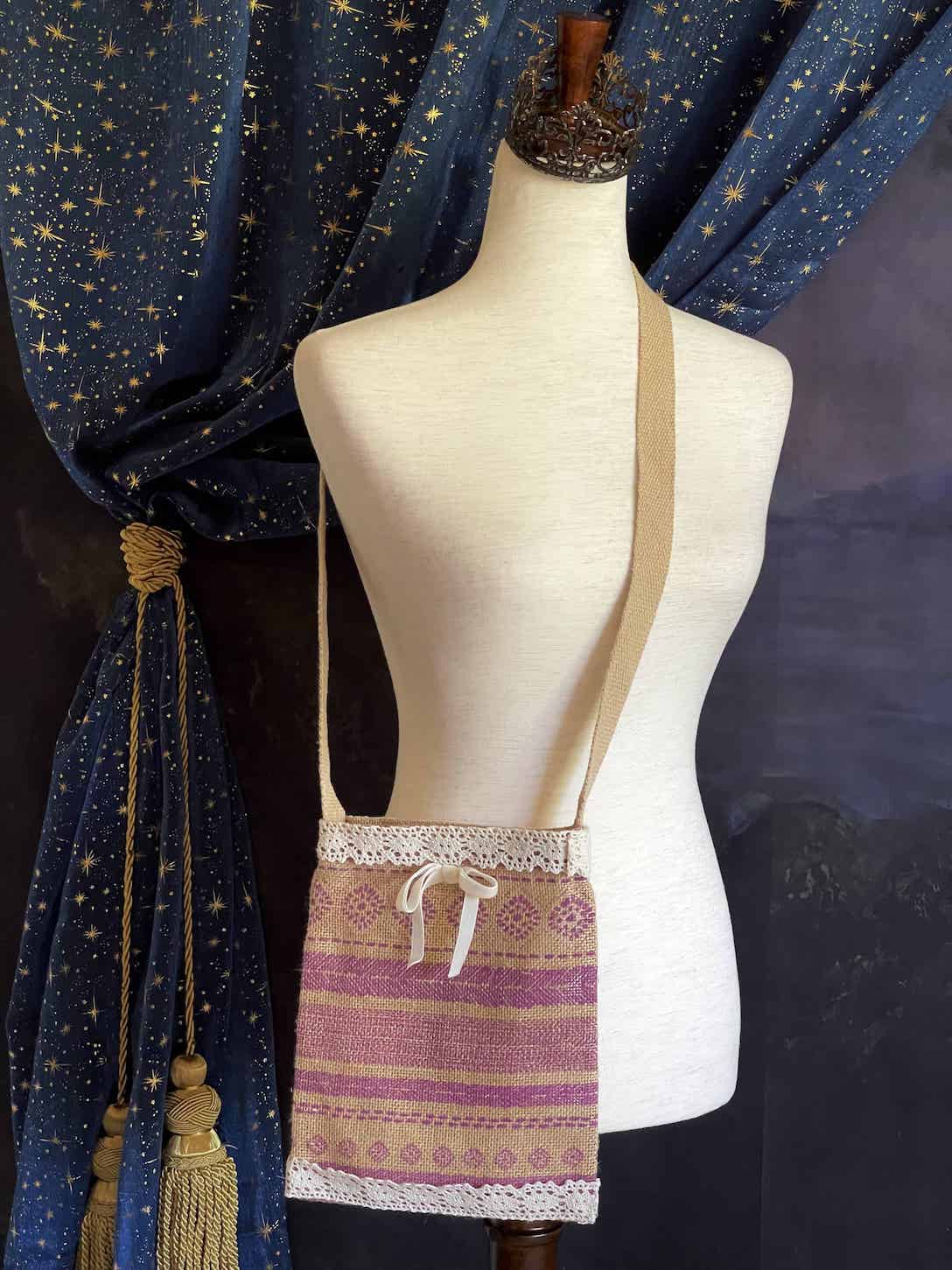 A cottagecore folk print historically inspired vintage style Handmade Lace-Trimmed Burlap Crossbody Bag in Lilac x Ivory