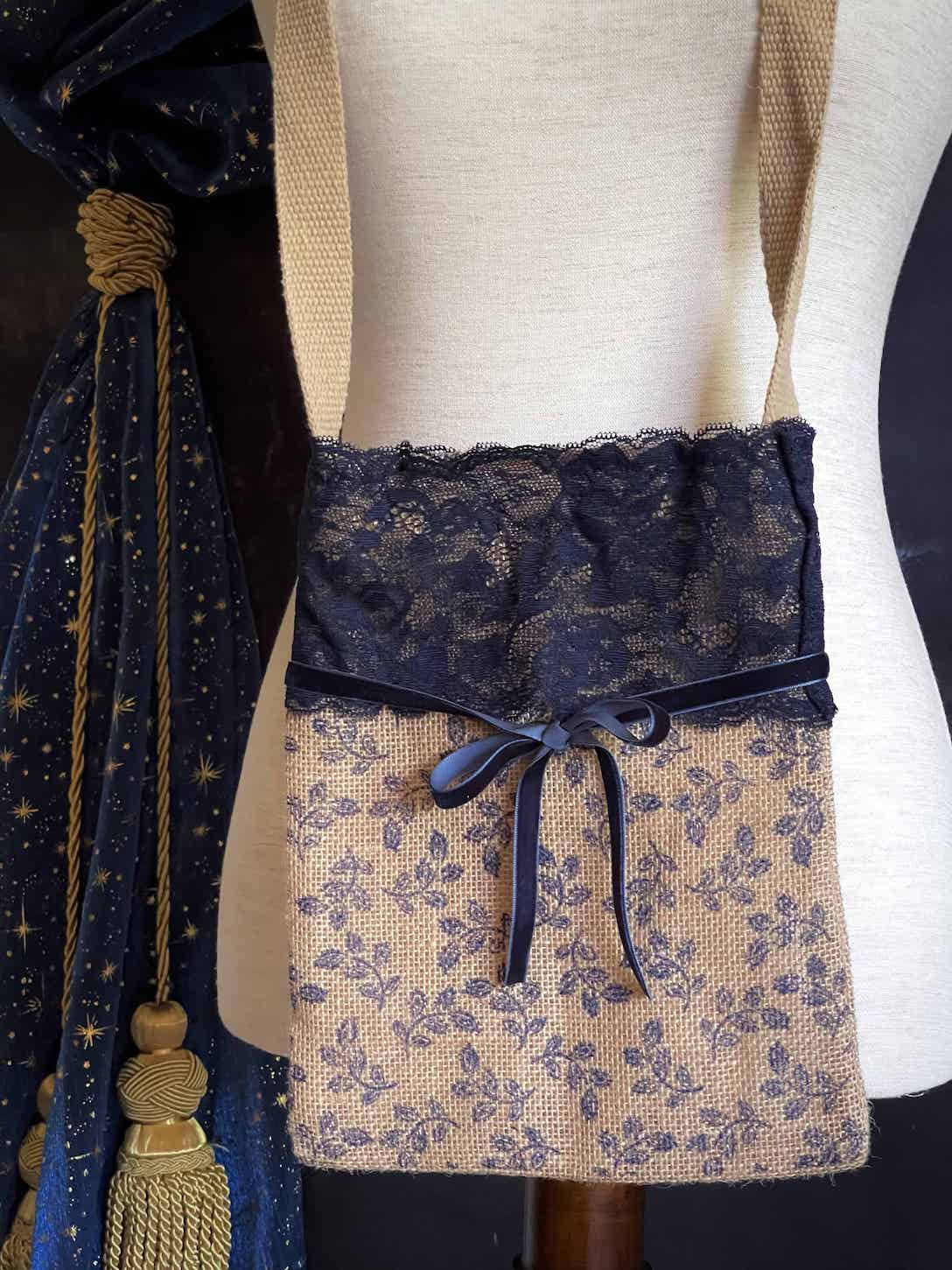 A Handmade Lace-Trimmed Jute Crossbody Bag in Navy Blue, vintage style cottagecore folk purse.