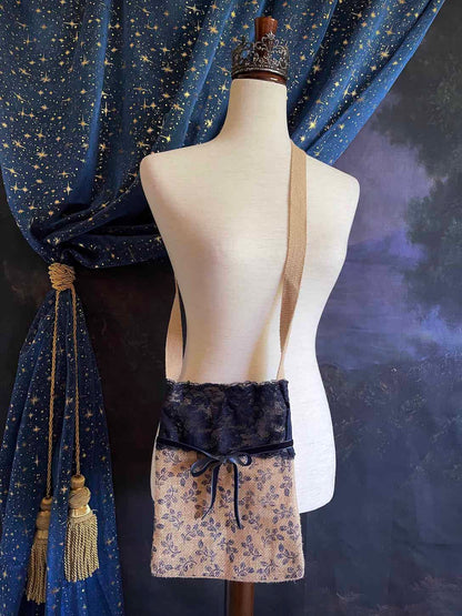 A Handmade Lace-Trimmed Jute Crossbody Bag in Navy Blue, vintage style cottagecore folk purse.