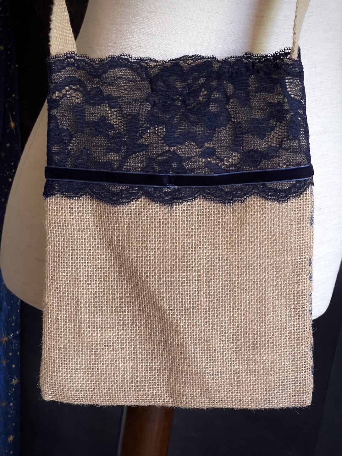 A Handmade Lace-Trimmed Jute Crossbody Bag in Navy Blue, vintage style cottagecore folk purse.