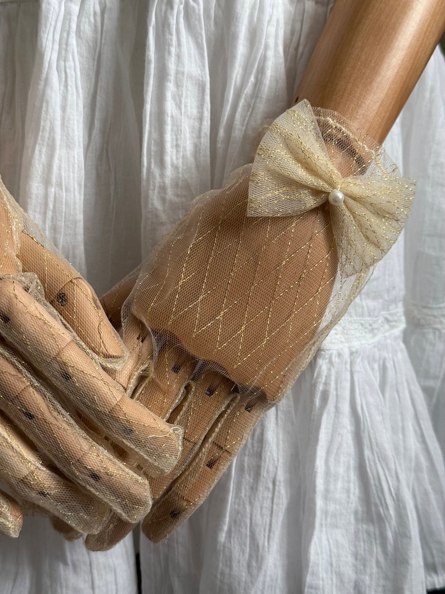 A Pair of Historically Inspired Sheer Lace Gloves with Bow Detail in Champagne Gold. Renaissance, regency, rococo, Victorian era gloves.