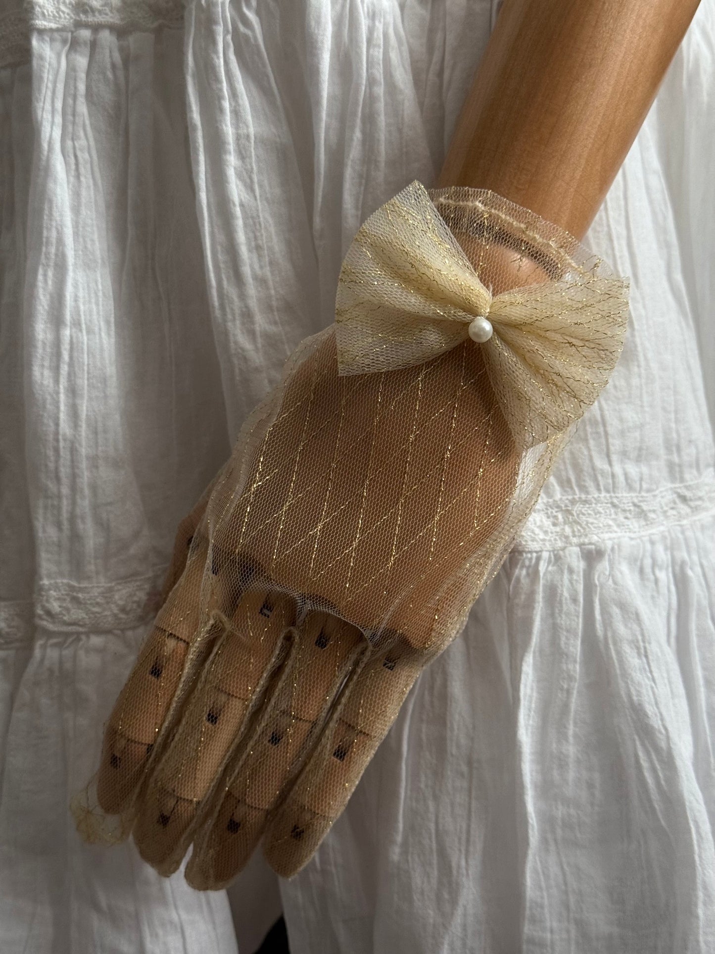 A Pair of Historically Inspired Sheer Lace Gloves with Bow Detail in Champagne Gold. Renaissance, regency, rococo, Victorian era gloves.