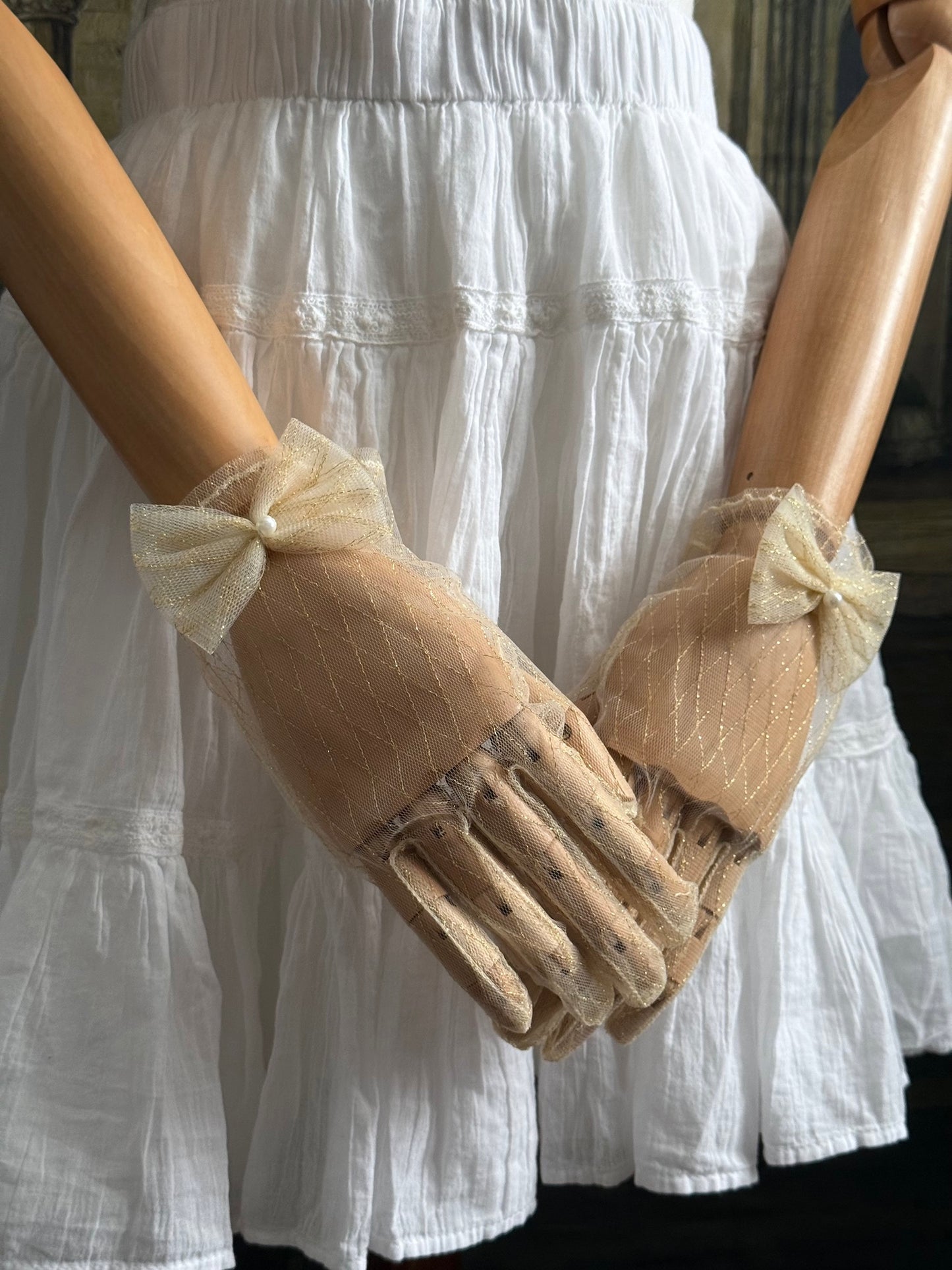 A Pair of Historically Inspired Sheer Lace Gloves with Bow Detail in Champagne Gold. Renaissance, regency, rococo, Victorian era gloves.
