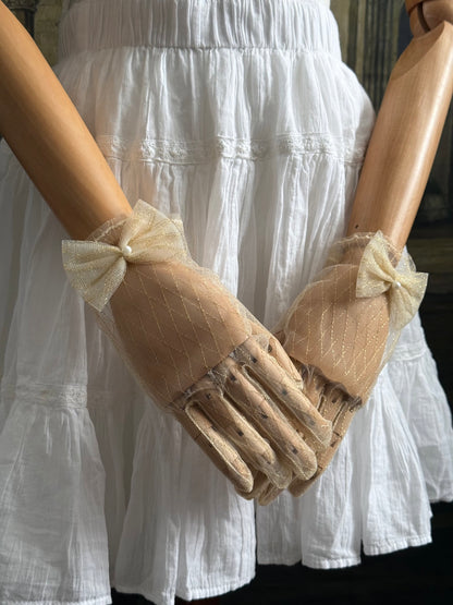 A Pair of Historically Inspired Sheer Lace Gloves with Bow Detail in Champagne Gold. Renaissance, regency, rococo, Victorian era gloves.