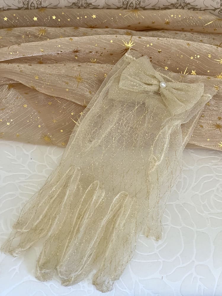 A Pair of Historically Inspired Sheer Lace Gloves with Bow Detail in Champagne Gold. Renaissance, regency, rococo, Victorian era gloves.