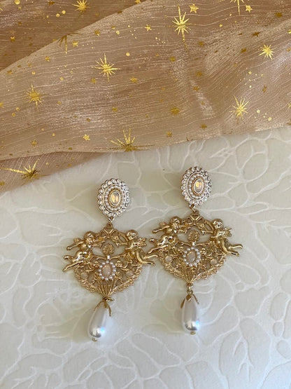 Historically inspired art history Renaissance Baroque Rococo angel sculpture filigree dangle earrings with pearl accents, clip on and regular, in gold.