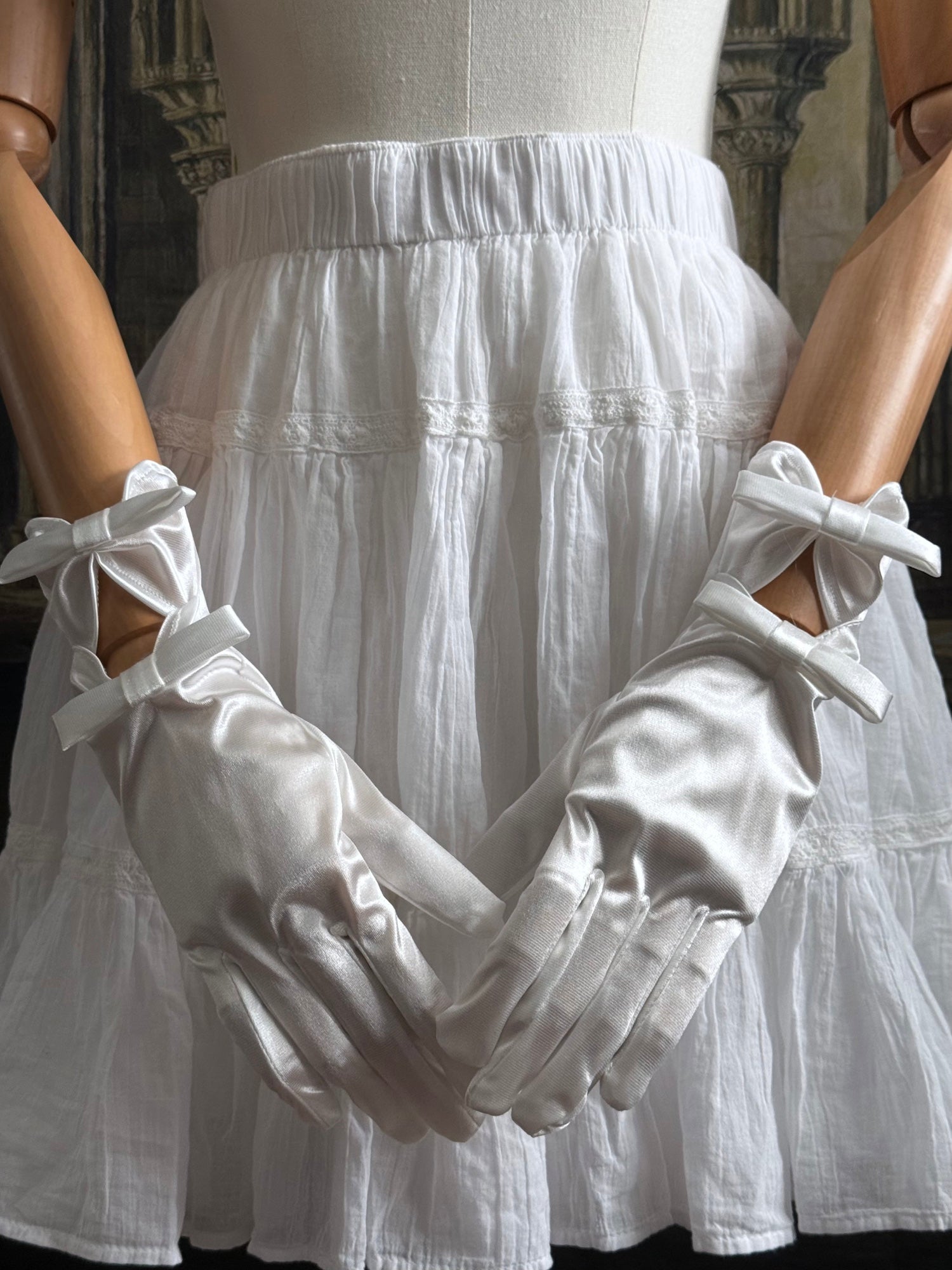 A Pair of Historically Inspired Regency and Rococo Era Satin Silk Gloves with Bow Details in White.