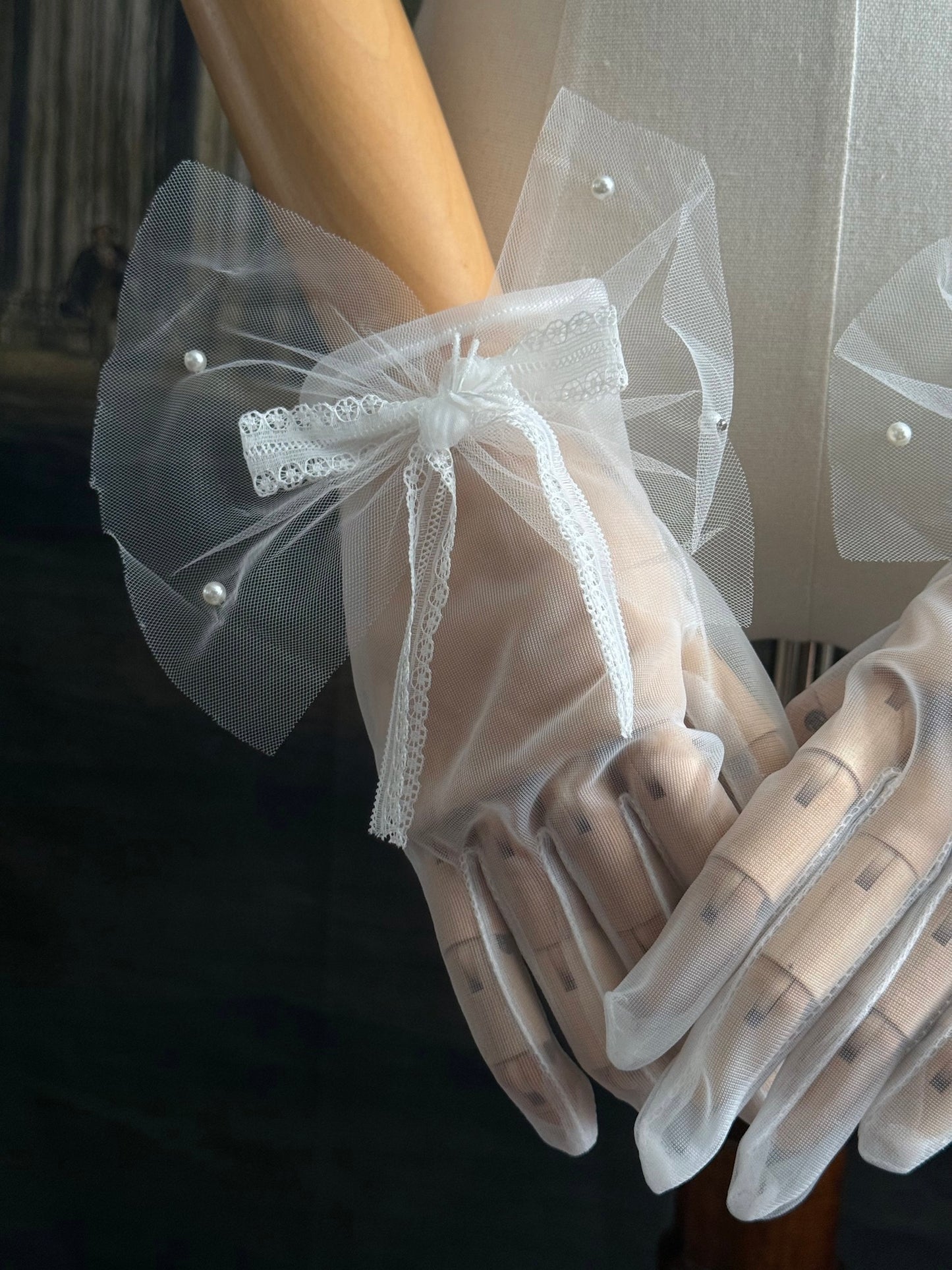 A Pair of Historically Inspired Sheer Gloves with Lace Bow Detail in White, with pearl accents. Perfect for regency, rococo, Victorian, and Edwardian eras.
