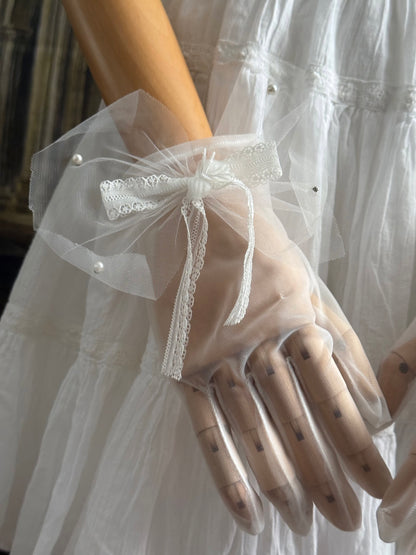 A Pair of Historically Inspired Sheer Gloves with Lace Bow Detail in White, with pearl accents. Perfect for regency, rococo, Victorian, and Edwardian eras.