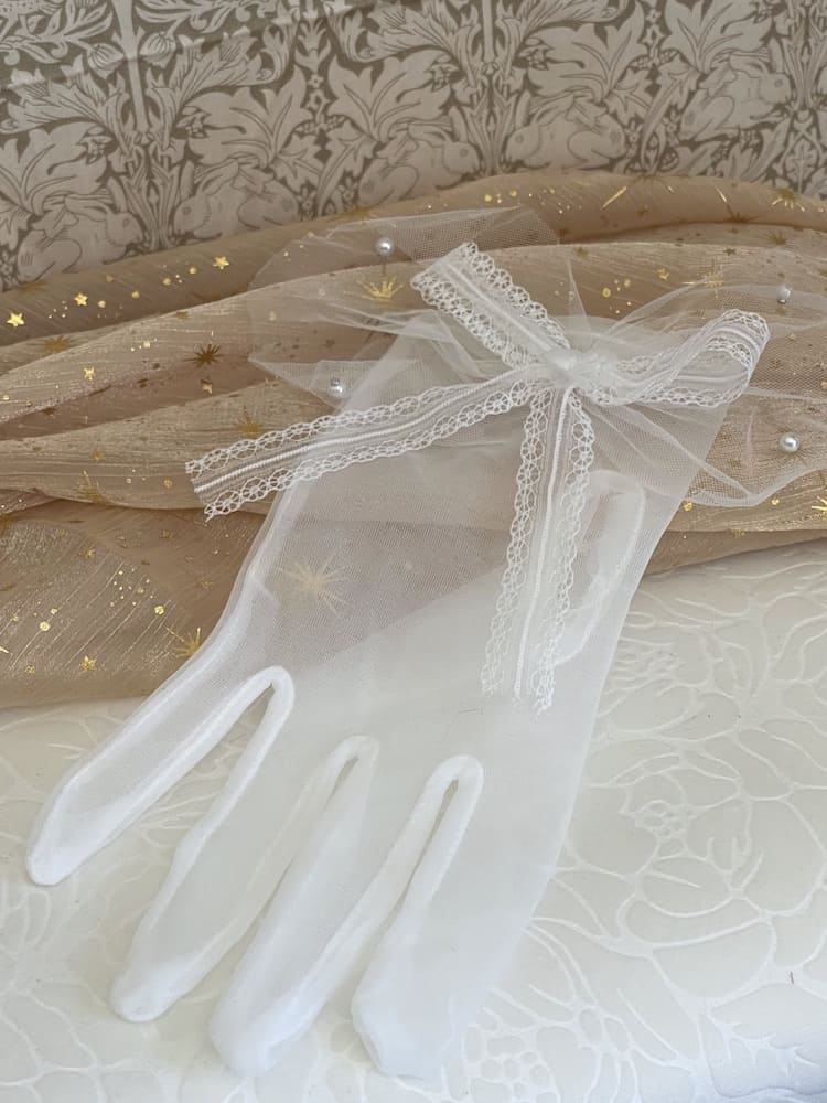A Pair of Historically Inspired Sheer Gloves with Lace Bow Detail in White, with pearl accents. Perfect for regency, rococo, Victorian, and Edwardian eras.