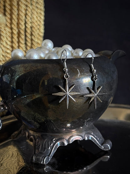 A pair of Handmade Medieval Inspired North Star Earrings in Aged Silver, dangly charms.