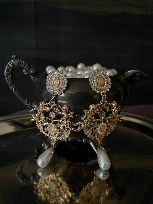 Historically inspired art history Renaissance Baroque Rococo angel sculpture filigree dangle earrings with pearl accents, clip on and regular, in gold.