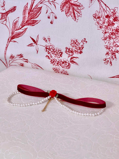 A  Handmade Historically Inspired Velvet Ribbon Pearl Choker Necklace in Burgundy, fit for Renaissance, Baroque, Rococo, Regency, Victorian, or Edwardian outfits..