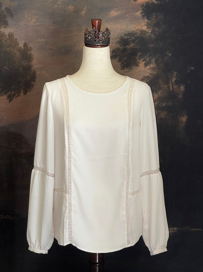 A Historically Inspired tailored Lace Inset Bishop Sleeve Blouse in Ivory, pictured in front of an art history backdrop.