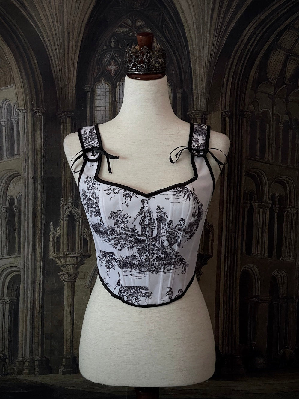 A Pair of Baroque & Rococo Era Gothic Black & White Toile Corset Stays with Satin Bowtied Ribbons.