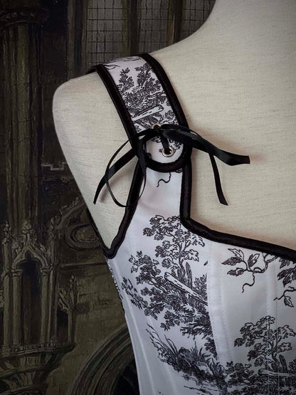 A Pair of Baroque & Rococo Era Gothic Black & White Toile Corset Stays with Satin Bowtied Ribbons.