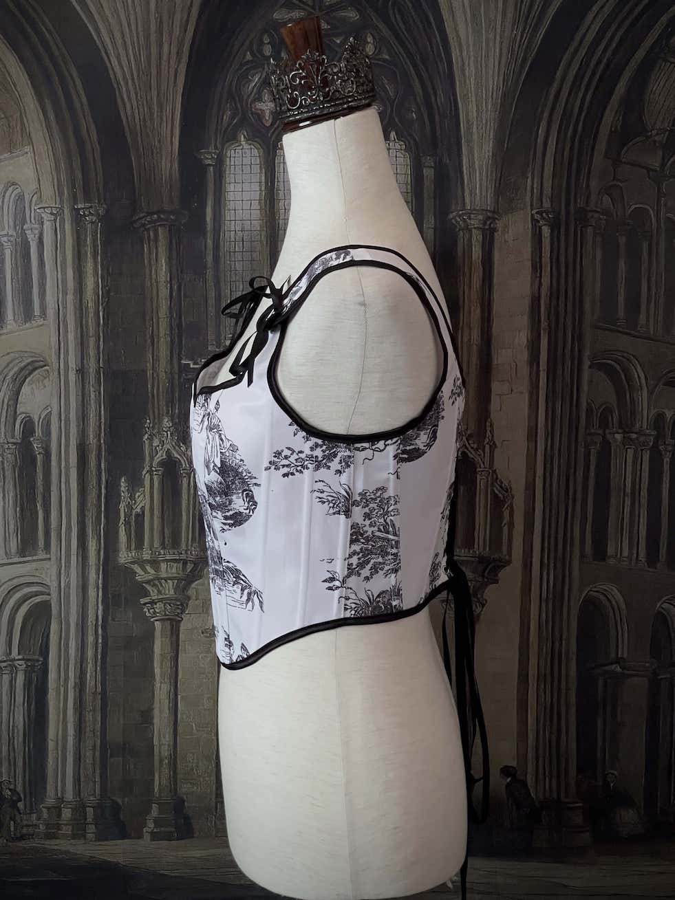 A Pair of Baroque & Rococo Era Gothic Black & White Toile Corset Stays with Satin Bowtied Ribbons.