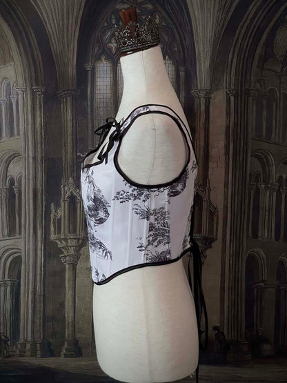 A Pair of Baroque & Rococo Era Gothic Black & White Toile Corset Stays with Satin Bowtied Ribbons.