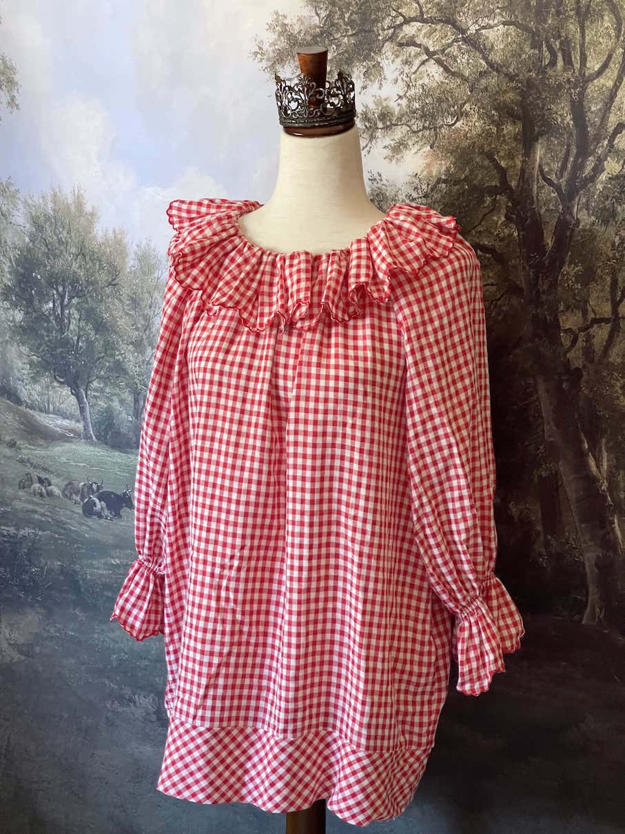 A Historically Inspired vintage style victorian countryside cottage gingham tunic dress in red and white, with ruffle collar and scalloped hem bishop sleeves.