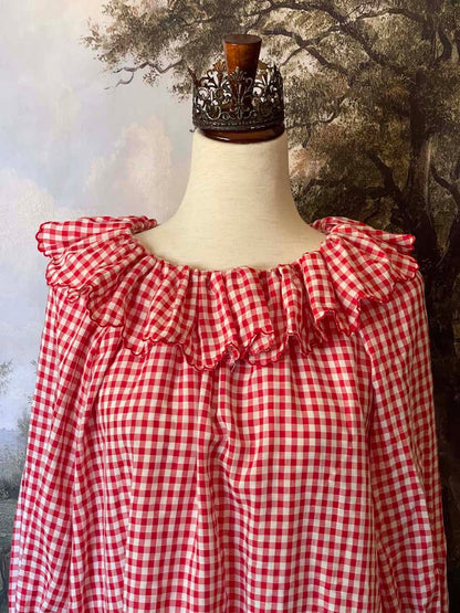 A Historically Inspired vintage style victorian countryside cottage gingham tunic dress in red and white, with ruffle collar and scalloped hem bishop sleeves.