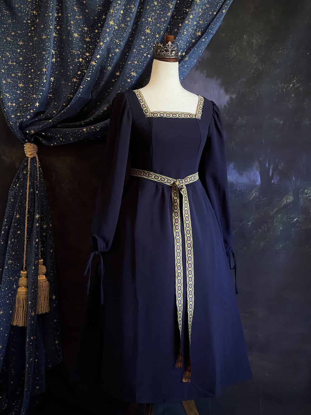 A Historically Inspired Tudor Style Medieval Renaissance Bishop Sleeve Square Neck Midi Dress with Embroidered trim and Detachable Belt, in Navy Saxon Blue x Gold.