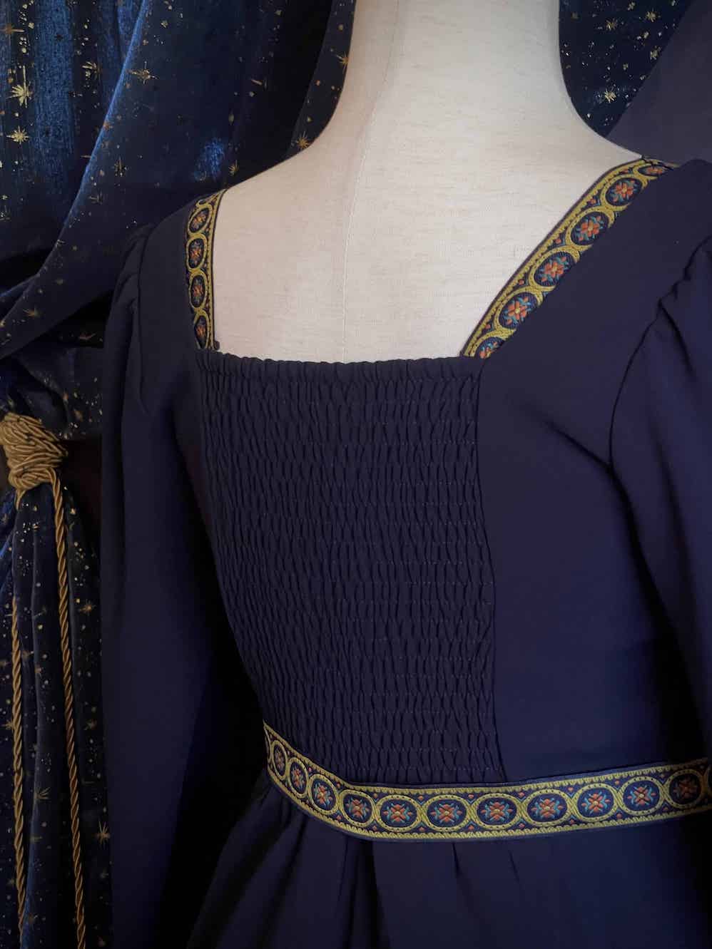 A Historically Inspired Tudor Style Medieval Renaissance Bishop Sleeve Square Neck Midi Dress with Embroidered trim and Detachable Belt, in Navy Saxon Blue x Gold.