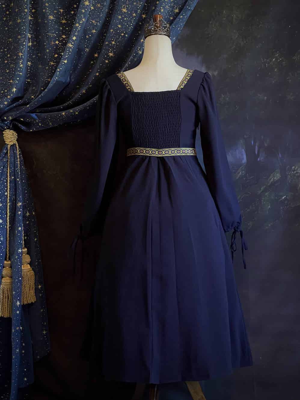 A Historically Inspired Tudor Style Medieval Renaissance Bishop Sleeve Square Neck Midi Dress with Embroidered trim and Detachable Belt, in Navy Saxon Blue x Gold.