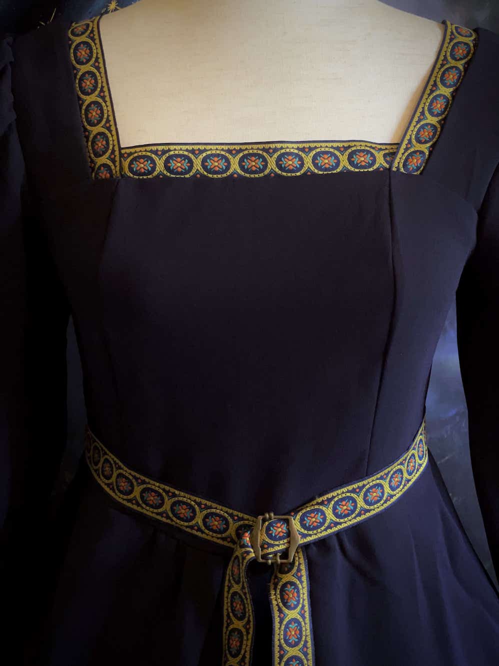 A Historically Inspired Tudor Style Medieval Renaissance Bishop Sleeve Square Neck Midi Dress with Embroidered trim and Detachable Belt, in Navy Saxon Blue x Gold.