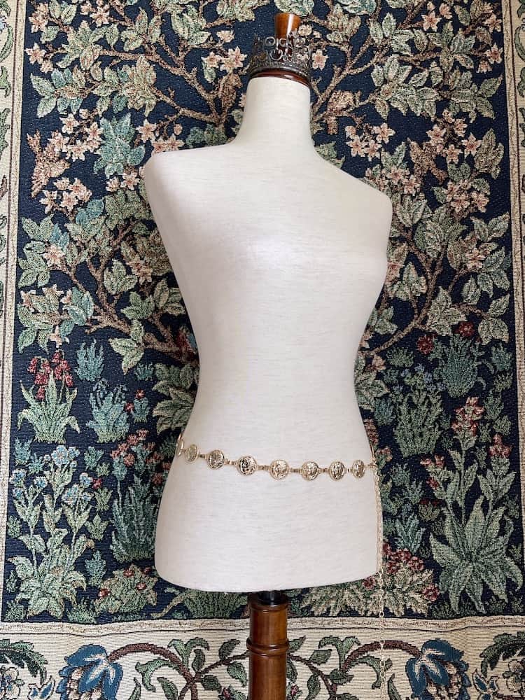 A Historically Inspired Renaissance and Medieval Classical Cameo Coin Belt in Gold on a mannequin.