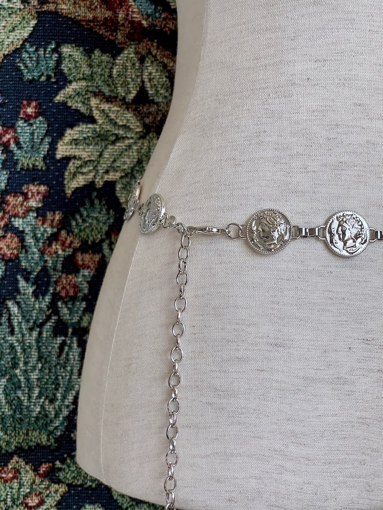 A Historically Inspired Renaissance and Medieval Classical Cameo Coin Belt in Silver pictured on a mannequin.
