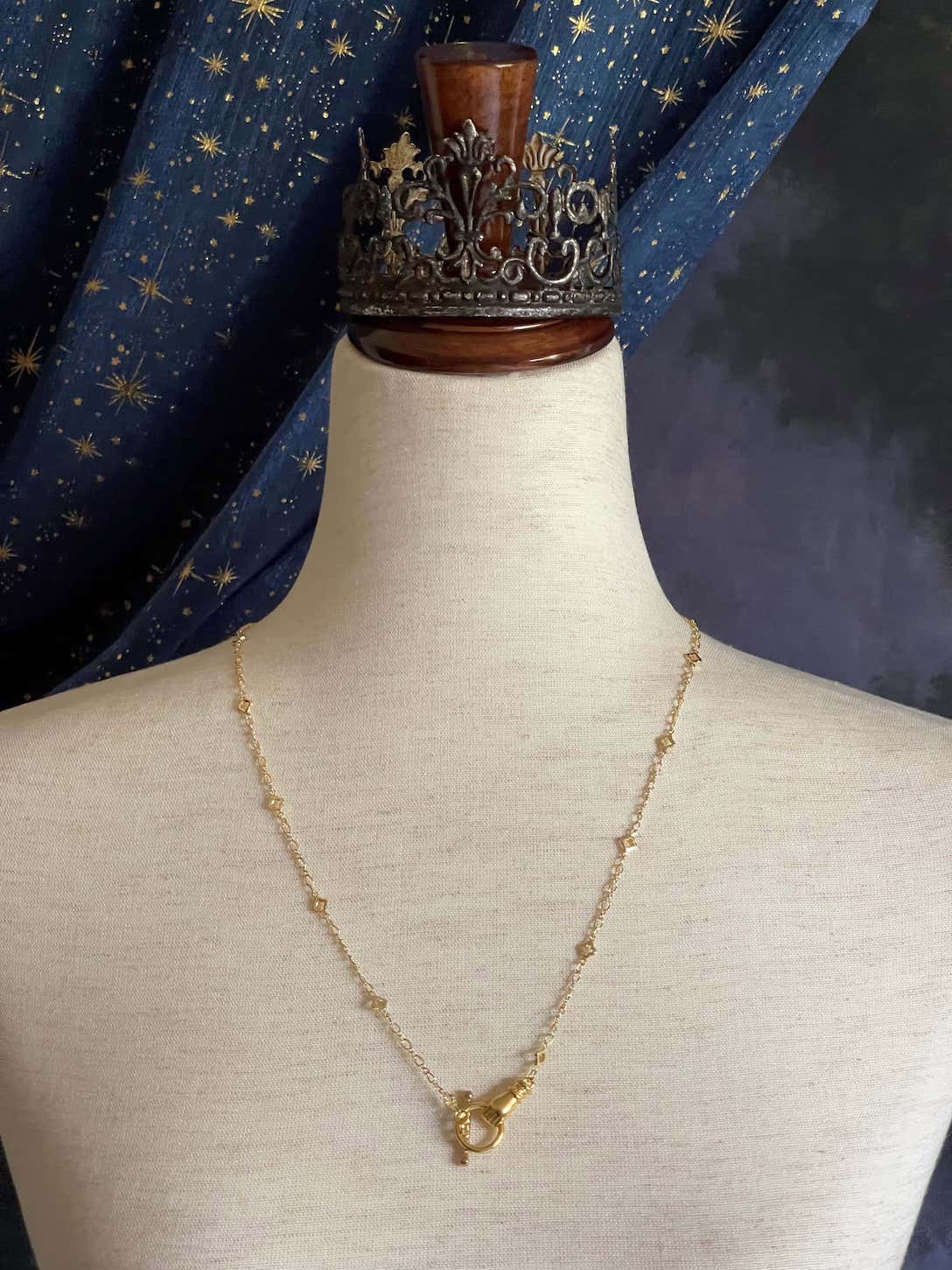 A Handmade Medieval Hand Toggle Clasp Necklace in Gold with Quatrefoil Motif Chain.