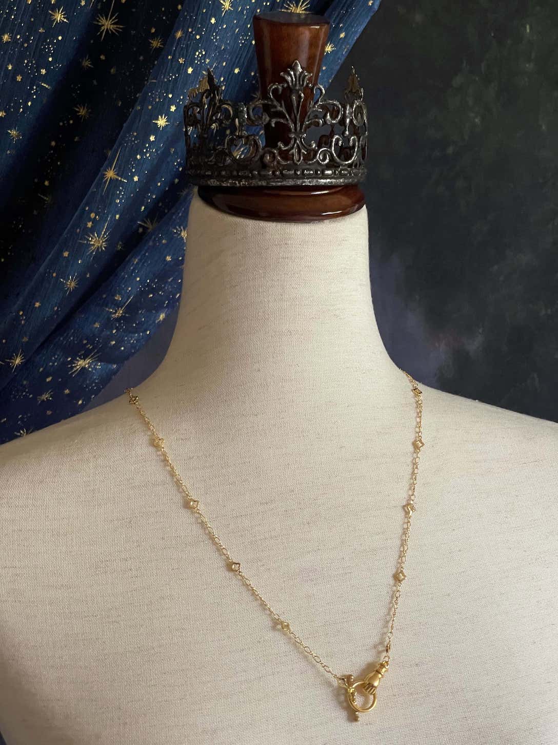 A Handmade Medieval Hand Toggle Clasp Necklace in Gold with Quatrefoil Motif Chain.