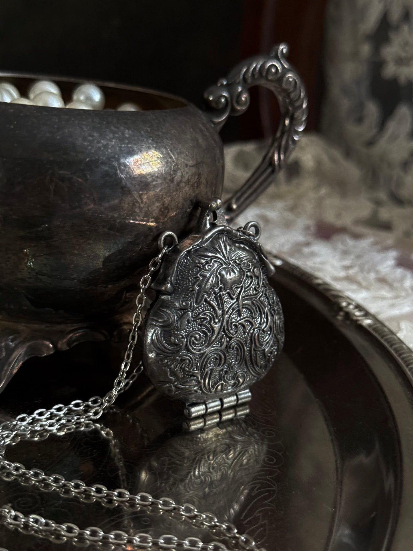 Victorian inspired historical coin purse trinket box pendant necklace with repousse designs in a darkened tarnished finish