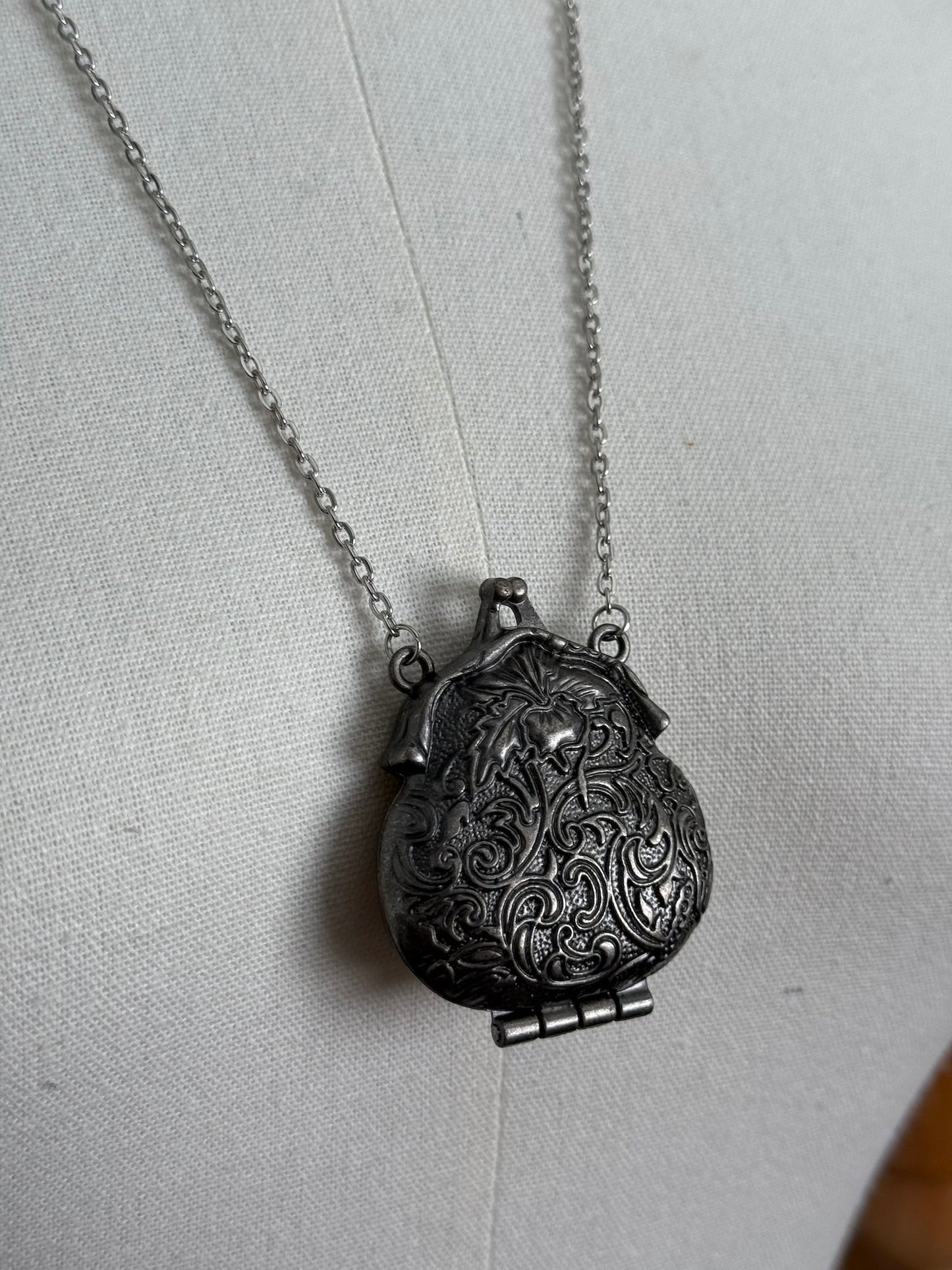Victorian inspired historical coin purse trinket box pendant necklace with repousse designs in a darkened tarnished finish