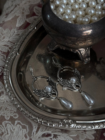 Historically inspired Turn-of-the-Century Art Nouveau Silverwork style  Earrings with Pearl Dangle displayed on an antique silver dish