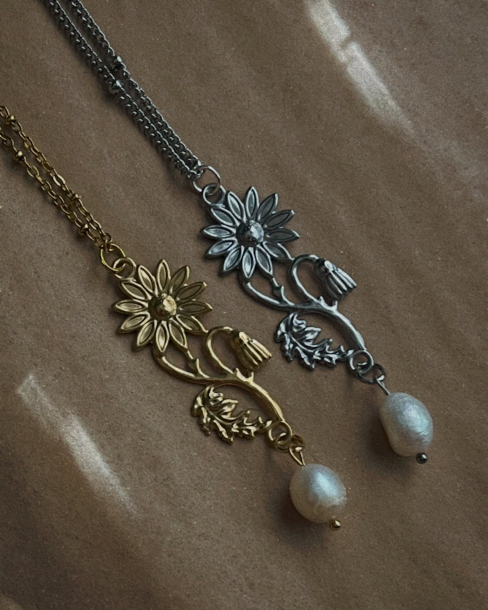 historical jewelry inspired vintage style daisy flower pendant necklaces with pearl dangles in silver and gold toned stainless steel