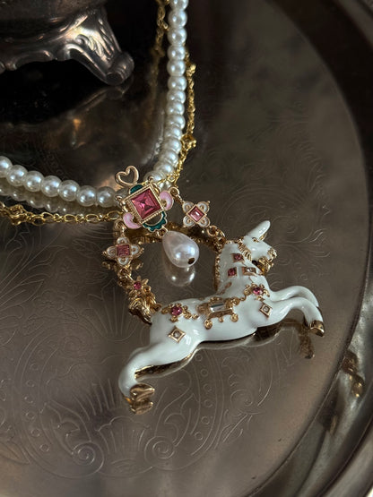 Close up of the jeweled unicorn pendant