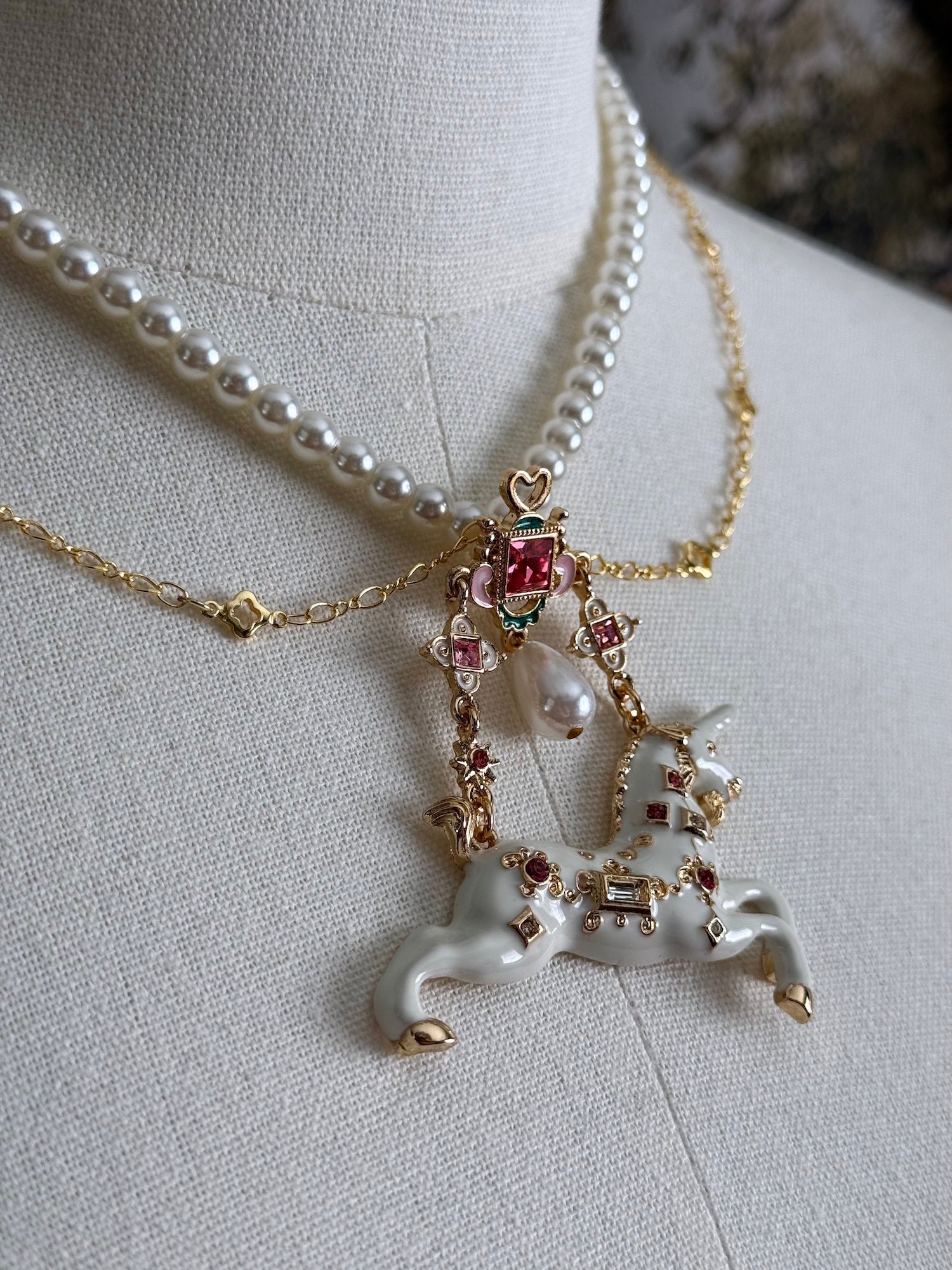 Close up of the jeweled unicorn pendant