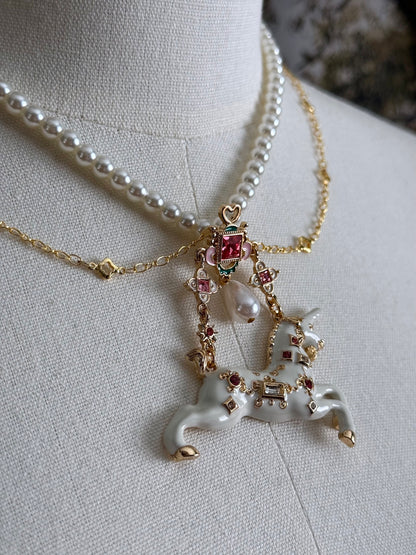Close up of the jeweled unicorn pendant