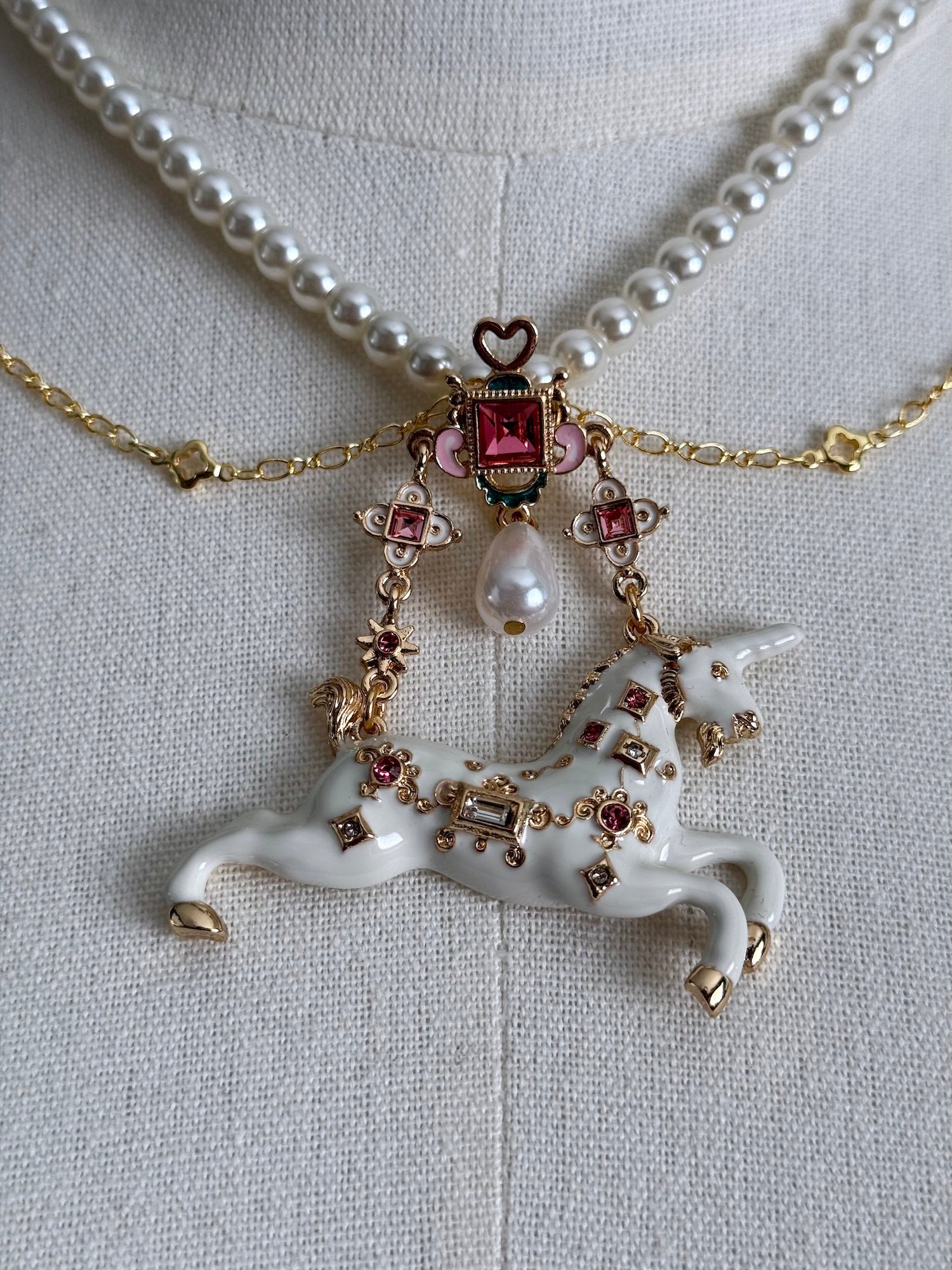 Close up of the jeweled unicorn pendant